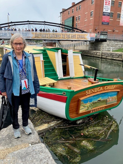 Laurie Lawlor with the replica of the Seneca Chief, which first traversed the Erie Canal in 1825.