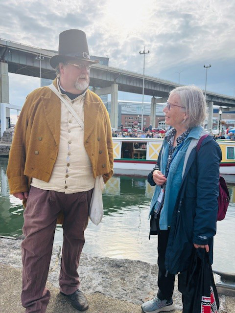 A costumed visitor at the Erie Canal Bicentennial with Laurie Lawlor