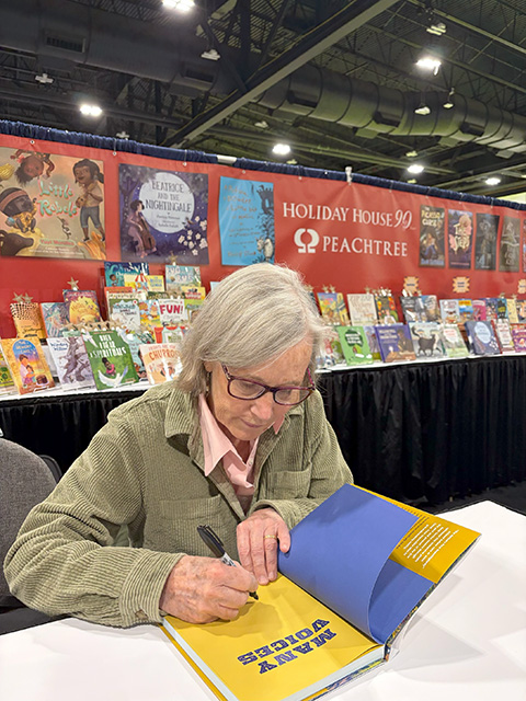 Laurie Lawlor signing Many Voices at the NCTE Conference